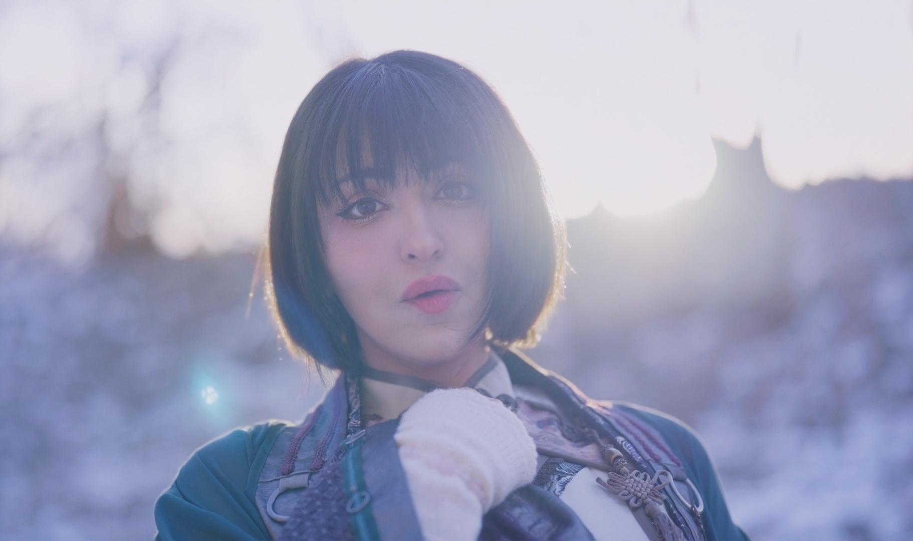 SUMI in green and white outfit for the KOURO music video in Japan